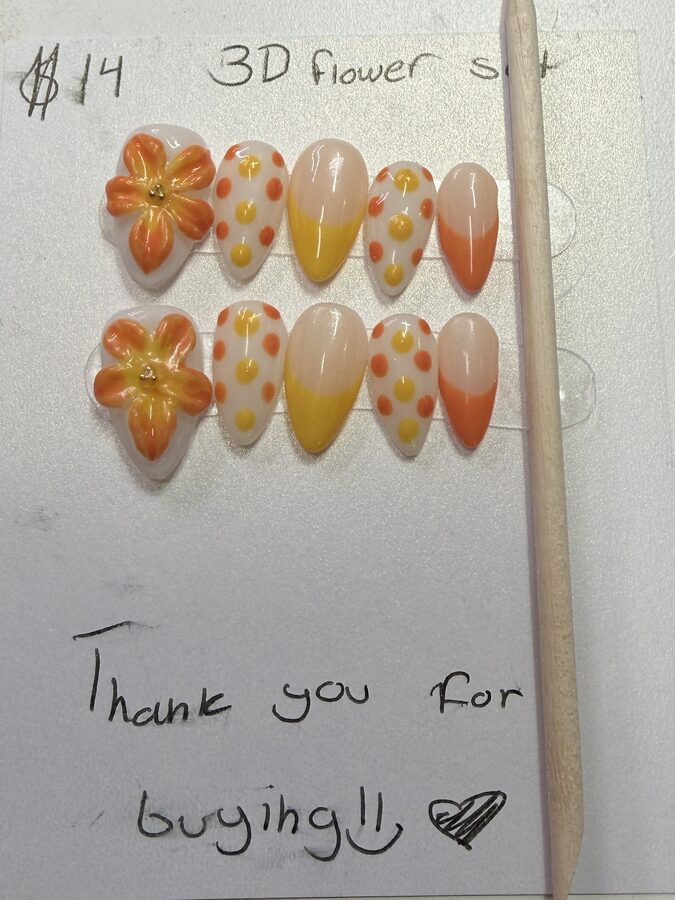 Orange and yellow 3D flower press-on nails with polka dots and French tips